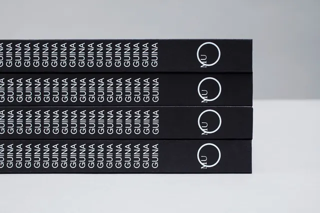 Branded packaging design with repeated wordmark, minimal, boxed, dark