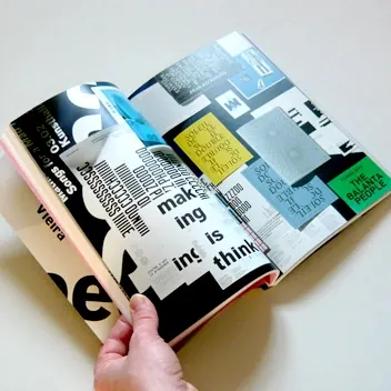 Design-focused book object flat lay, photographic, editorial, vibrant