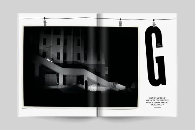 Editorial spread with large black-and-white image and oversized letter, editorial, monochrome, dark