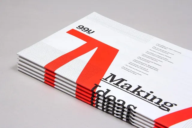 Stacked magazine with red accents, editorial, minimal, light