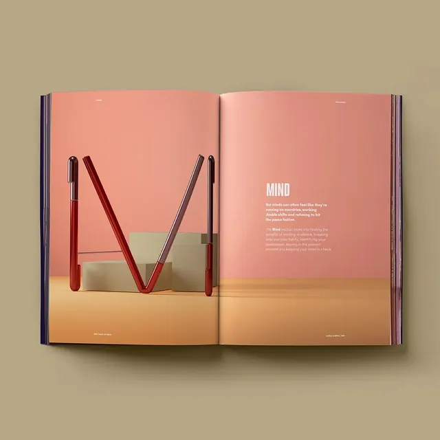 Design book spread with gradient and pen arrangement, editorial, gradient-heavy, warm