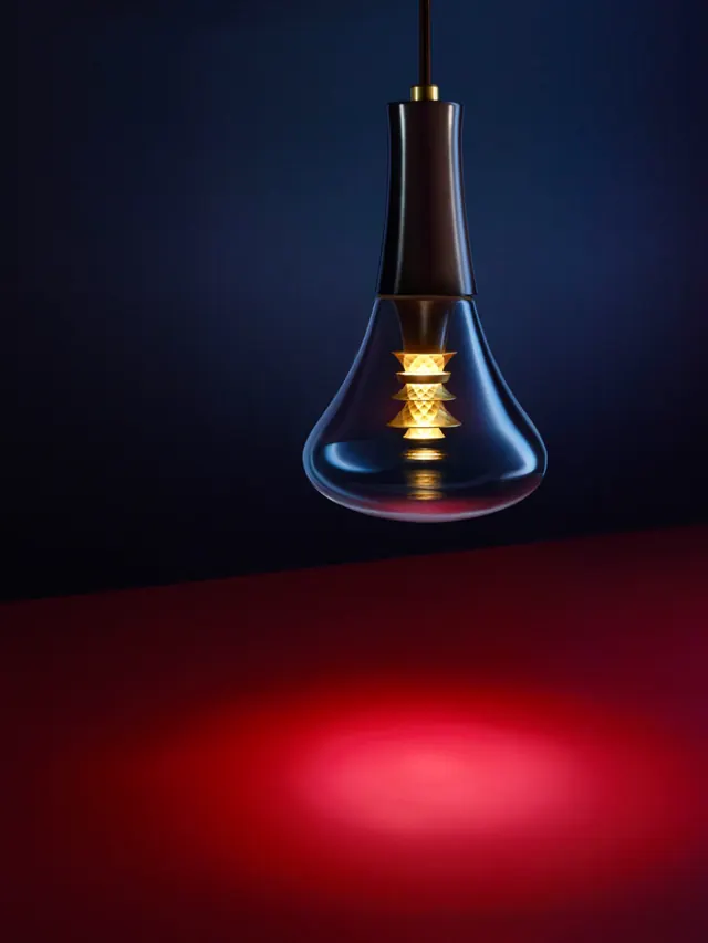 Illuminated light bulb with gradient glow lighting, photographic, luxury, dark