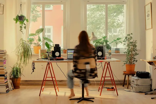 Music producer workspace interior with natural light, photographic, warm, warm