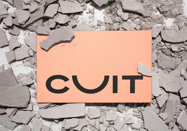 CULT wordmark on cracked surface, minimalist, bold, warm