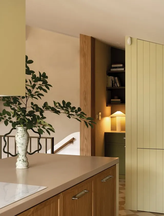 Modern kitchen with warm wood and striped accent wall, organic, minimal, warm