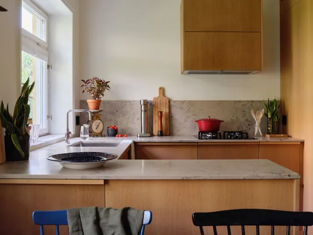 Warm minimalist kitchen interior, photographic, warm