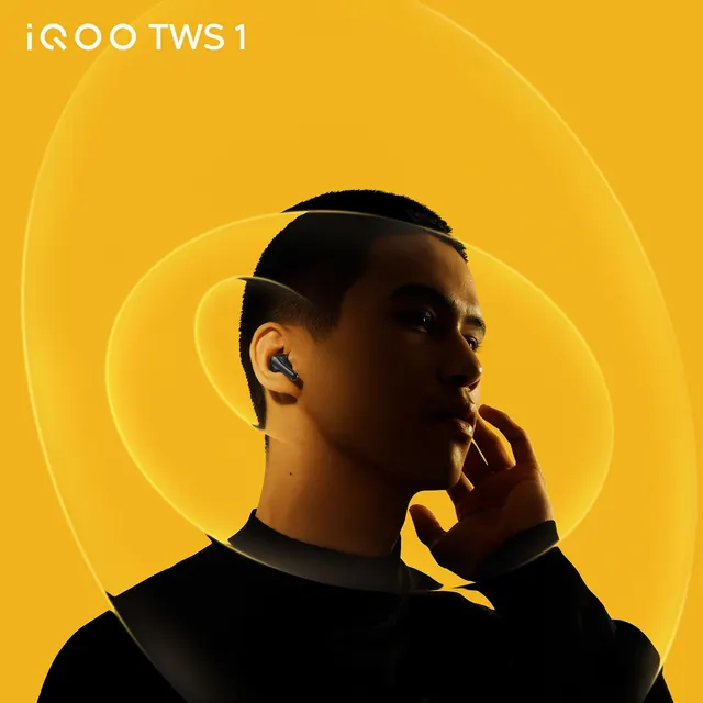 Premium wireless earbuds product shot with golden background, minimal, photographic, warm