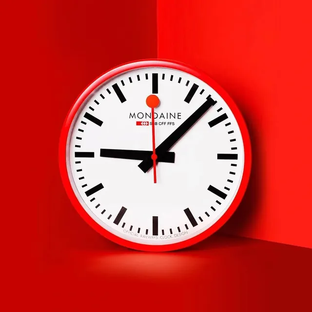 Mondaine red watch on red background, minimal, photographic, red