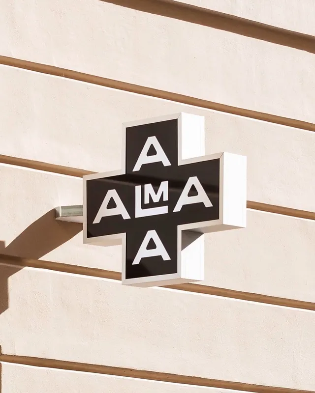 3D black cross signage with white letters, minimal, geometric, light