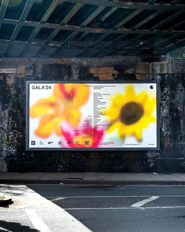 GALA'24 street billboard with sunflower graphic, minimal, photographic, warm