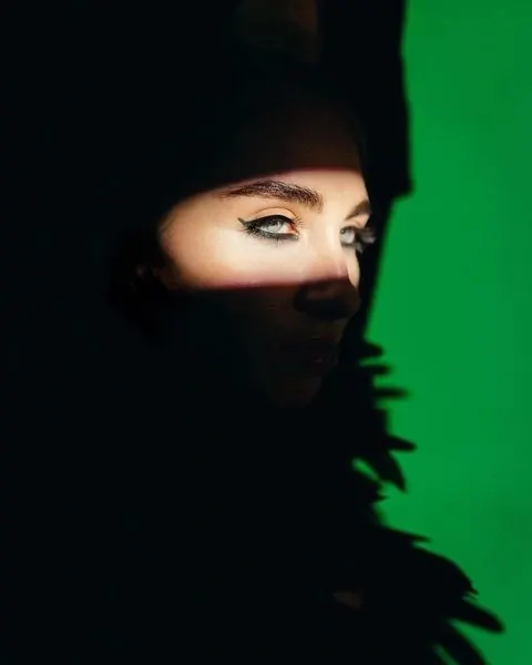 High-Contrast Portrait with Green Glow, dark-mode, photographic, dark