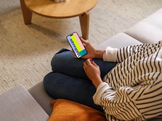 Lifestyle product shot of smartphone on couch, minimal, photographic, warm