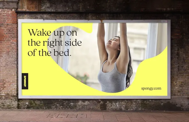 Spongy billboard: organic yellow curves and lifestyle photography, minimal, gradient-heavy, warm
