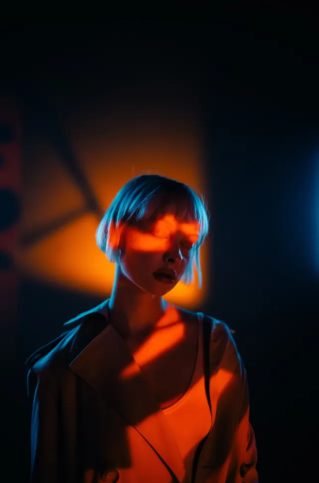 Cinematic Portrait with Orange Lighting, photographic, dark-mode, dark