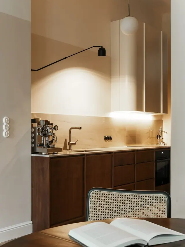 Minimalist bathroom with sculptural lighting, minimal, corporate-clean, warm