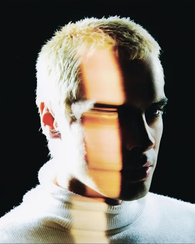 High-Contrast Portrait with Light Projection, minimal, monochrome, high-contrast