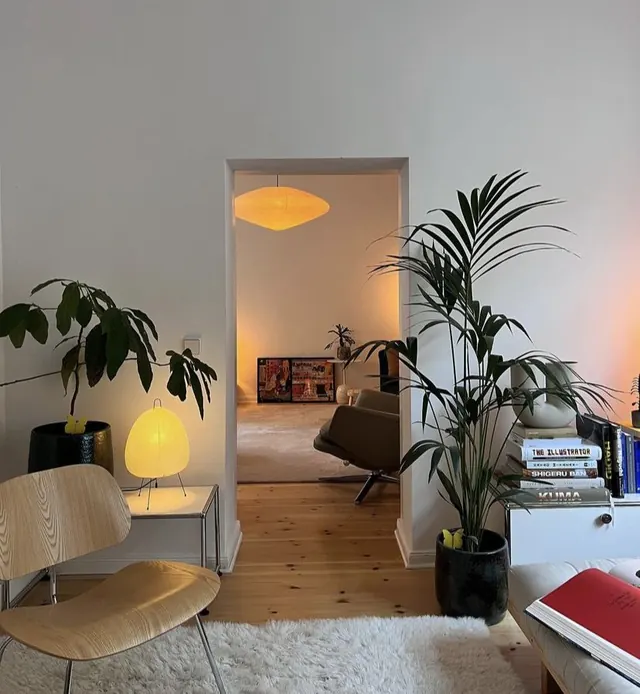 Minimalist residential interior with biophilic layering, minimal, photographic, muted