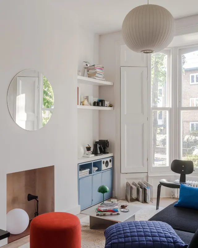 Scandinavian interior with blue cabinetry and accent pops, minimal, light-mode, light