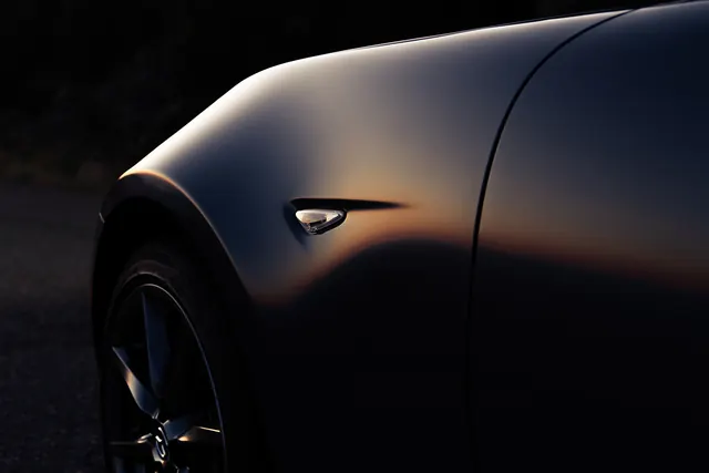 Dramatic automotive CGI with warm metallics, 3d-render, photographic, dark
