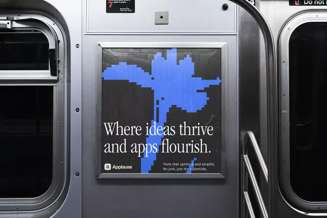 Applesause transit ad with pixelated blue blob, minimal, corporate-clean, dark