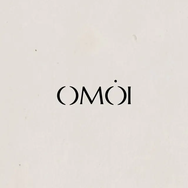 COMOI wordmark in geometric sans-serif, minimal, geometric, muted
