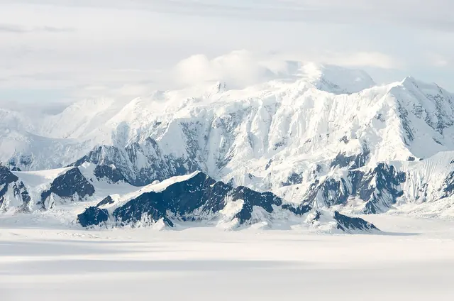 Snowy alpine peaks landscape photograph, minimal, photographic, light