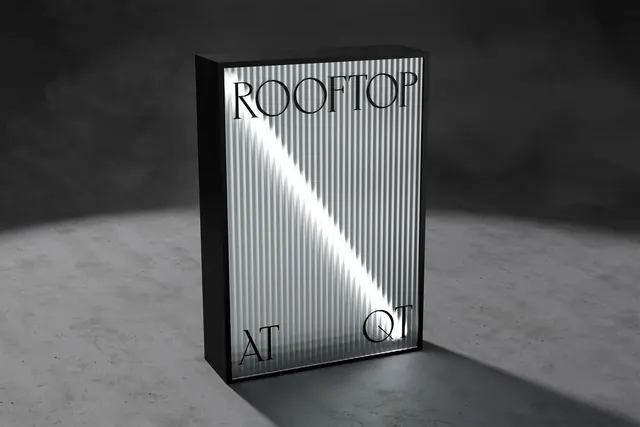 Illuminated corrugated metal sign "ROOFTOP AT QT, minimal, geometric, monochrome