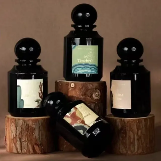 Luxury fragrance bottle packaging with earth-tone labels, minimal, luxury, muted