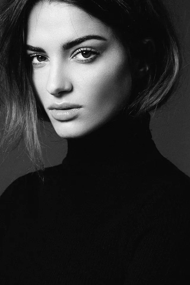 Portrait of a woman in black turtleneck, monochrome, minimal, monochrome