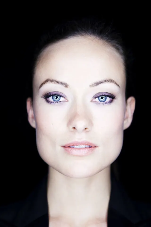 Portrait of a woman with blue eyeshadow, photographic, minimal, high-contrast