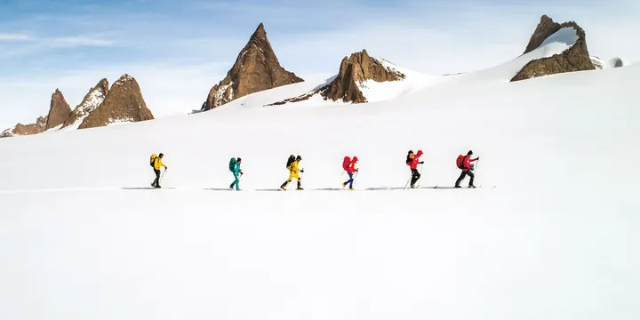 Mountain expedition climbers on alpine glacier, photographic, geometric, light