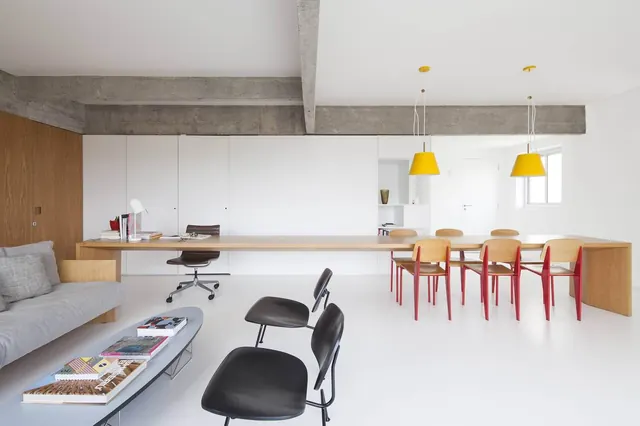 Minimalist open-plan interior with exposed concrete, minimal, corporate-clean, light
