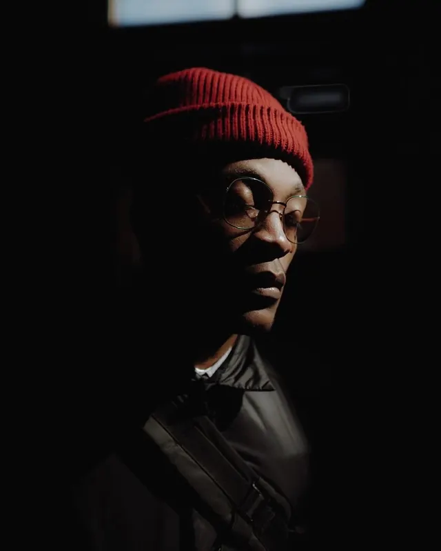 Portrait of a Person in Knit Beanie, dark-mode, photographic, dark