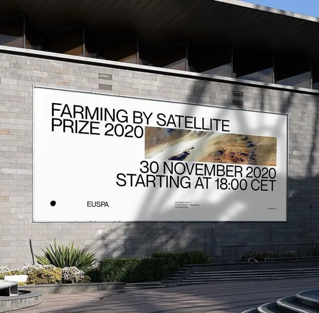 Minimalist prize event poster on stone facade, minimal, corporate-clean, light