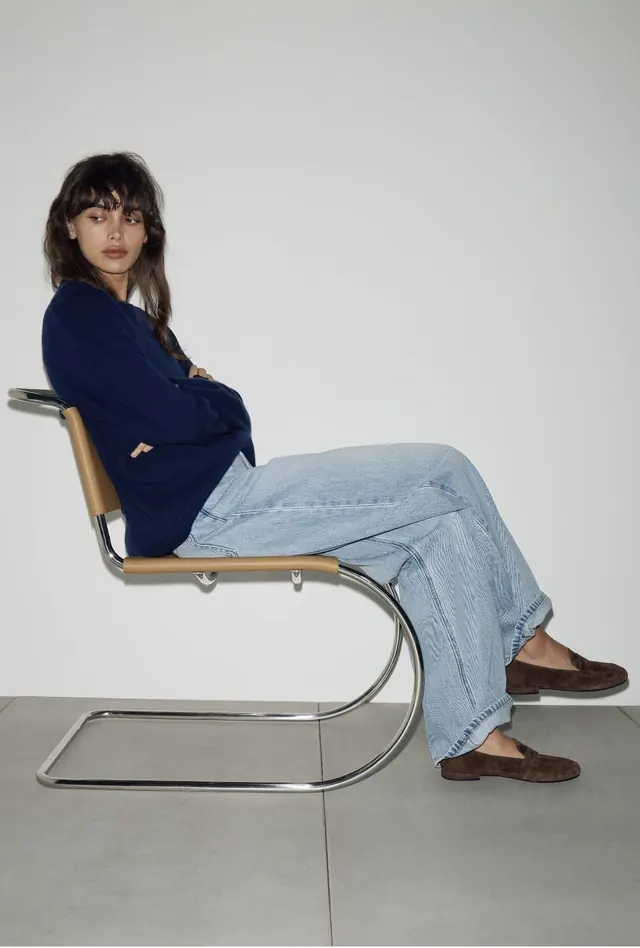 Studio portrait on minimalist cantilever chair, minimal, photographic, light