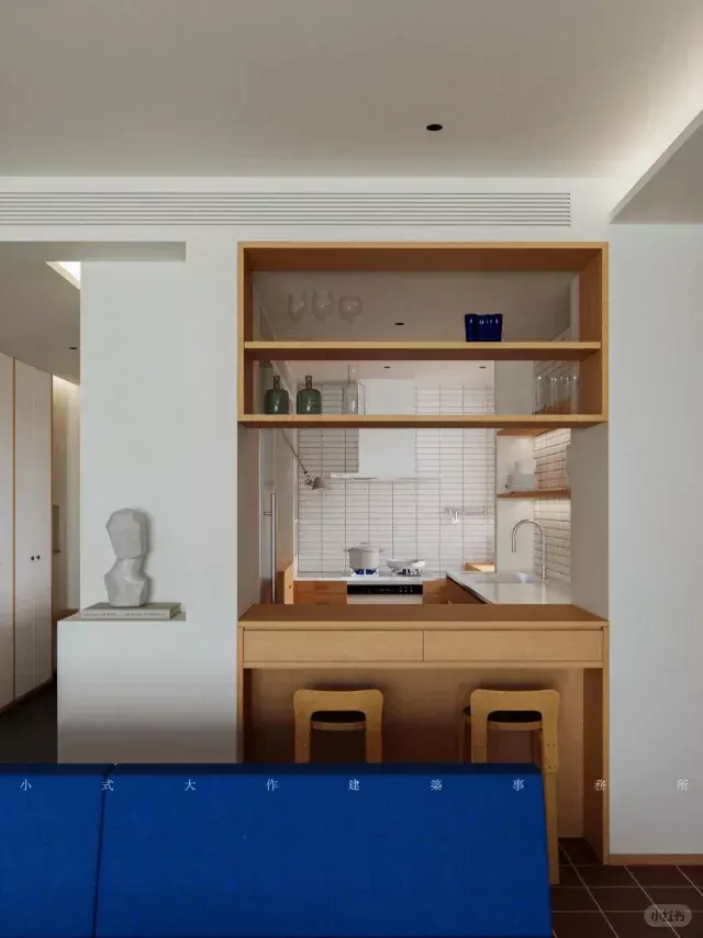 Modern kitchen with natural wood shelving and bright blue accent wall, minimal, corporate-clean, light