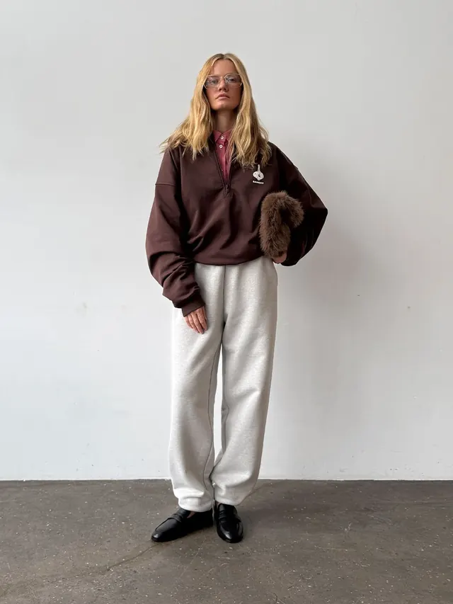 Neutral luxury editorial portrait with texture contrast, minimal, photographic, dark