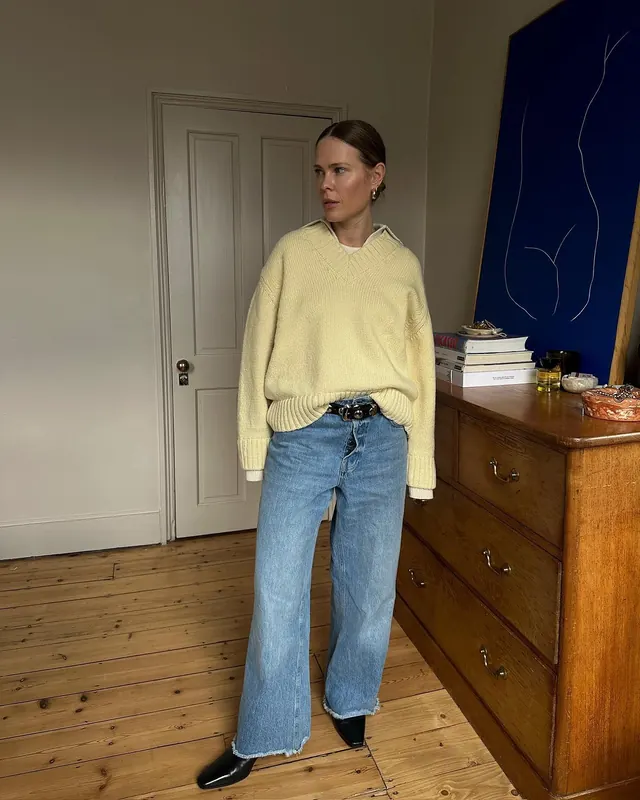Creamy knitwear with vintage denim lifestyle shot, minimal, photographic, light