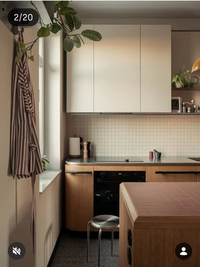 Warm-toned kitchen with natural wood and sage tile, minimal, photographic, warm