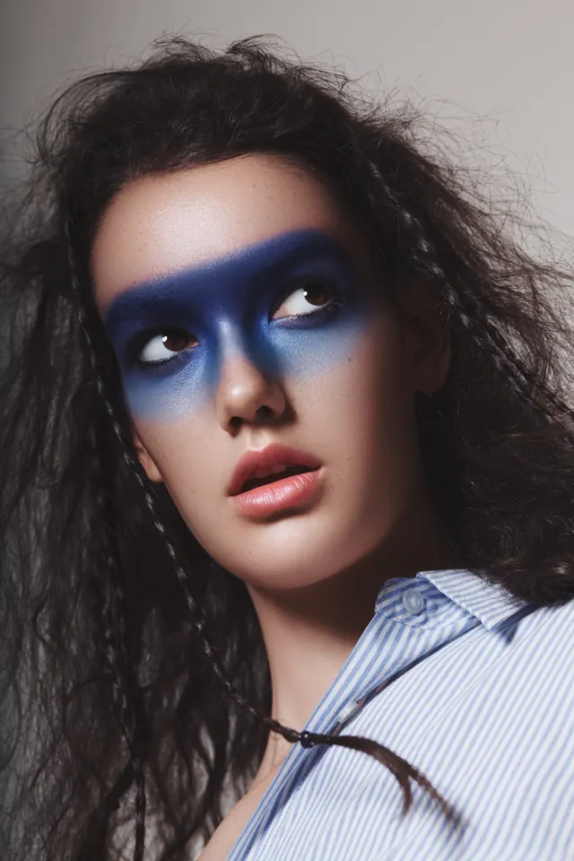 Blue Face Paint Portrait, photographic, maximalist, vibrant