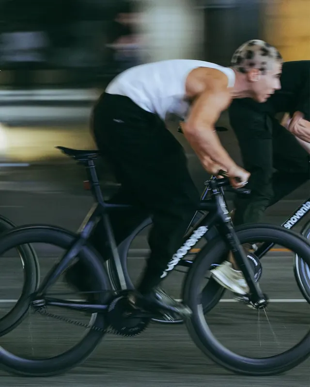 Cyclist on Road Bike, photographic, high-contrast