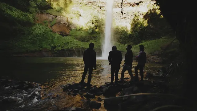 People Standing in a Forest Waterfall, photographic, organic, dark