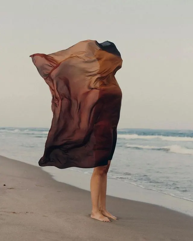 Person in Flowing Fabric on Beach, minimal, organic, earthy