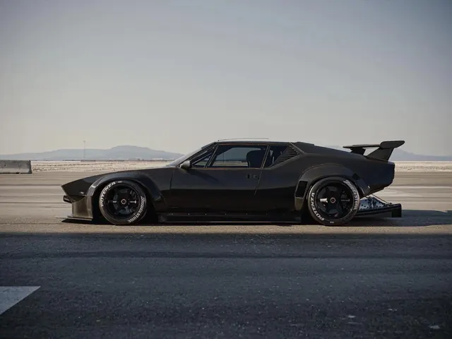 Black Sports Car on Coastal Road, photographic, luxury, dark