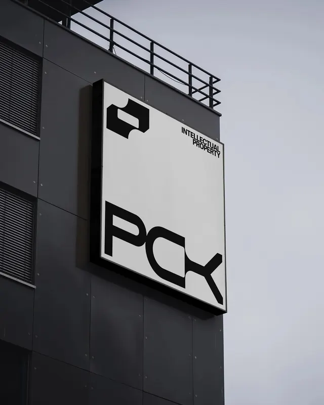PCX Logo Mockup on Building, minimal, corporate-clean, high-contrast