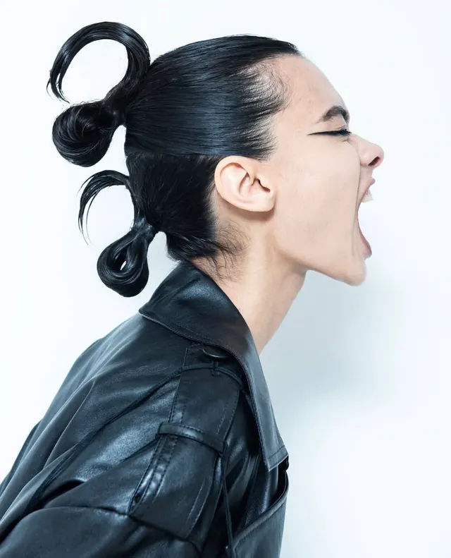 Profile of a Woman with Space Buns, minimal, photographic, monochrome