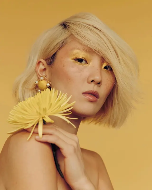 Portrait of a Woman with Yellow Flower, editorial, luxury, warm