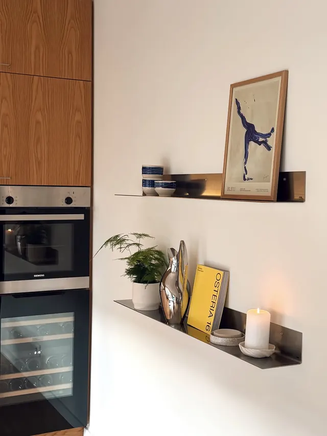 Interior shelving composition with warm wood and styled objects, photographic, warm