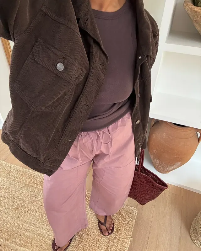 Layered neutral outfit and leather styling, photographic, muted