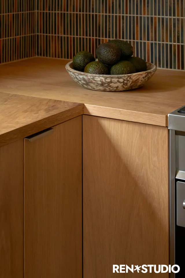 Warm-toned kitchen and cabinetry styling, photographic, minimal, warm